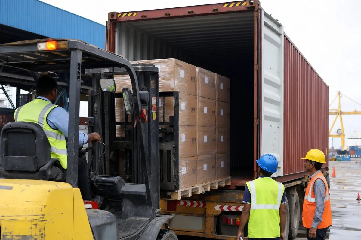 Forklift stuffing palletized cartons of Indian boxing gloves and punching bags into a shipping container for FCL export