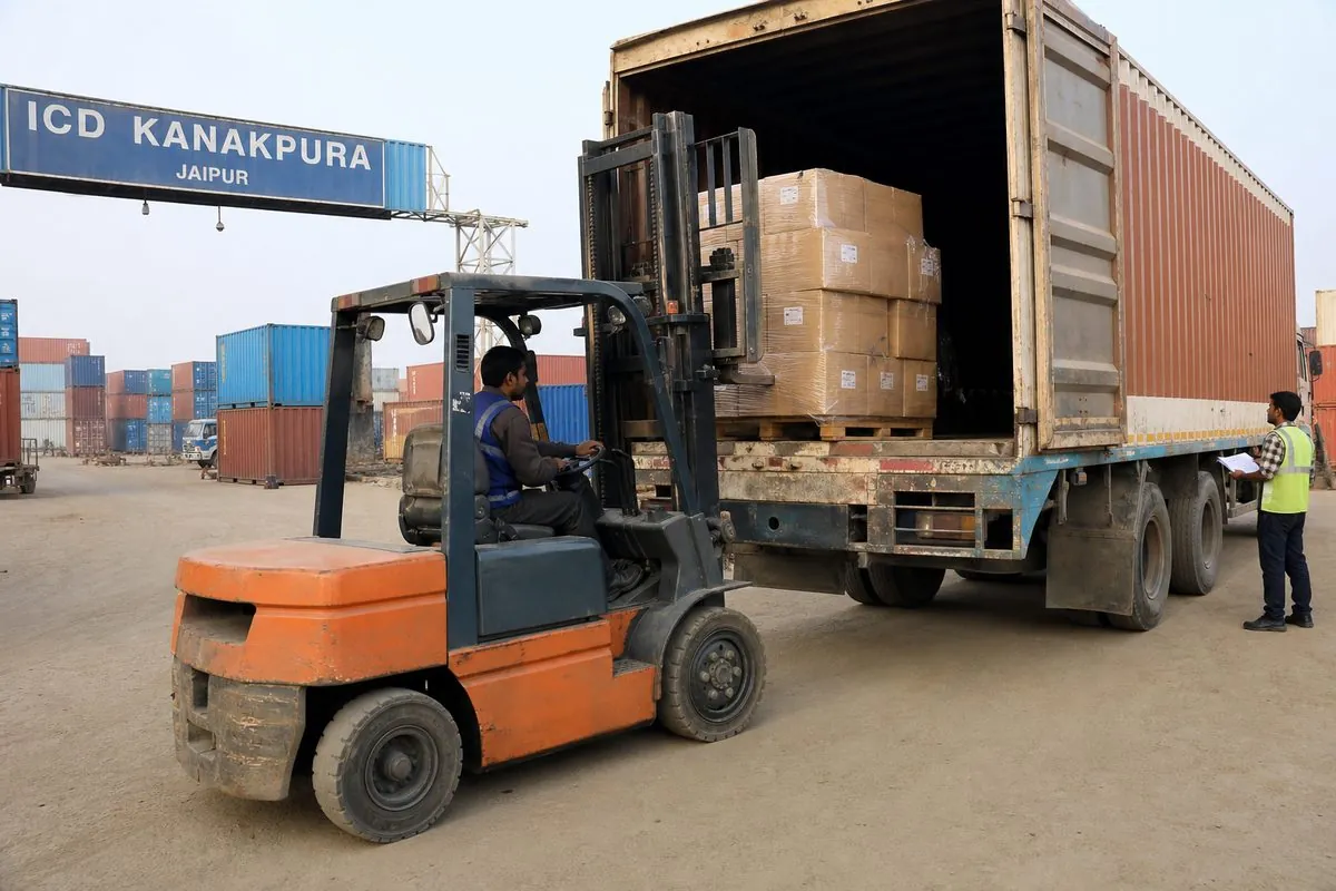 Forklift loading palletized Jaipur handicraft export cartons onto a freight truck for ICD Kanakpura