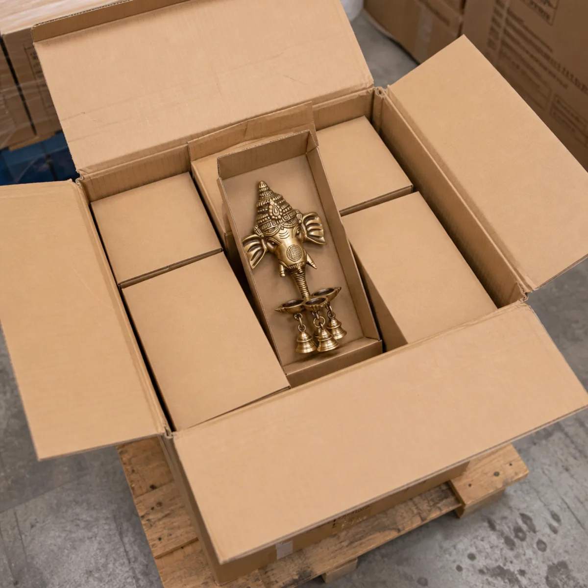 Export shipping carton with inner gift boxes of brass Ganesha deepak wall hangings from India