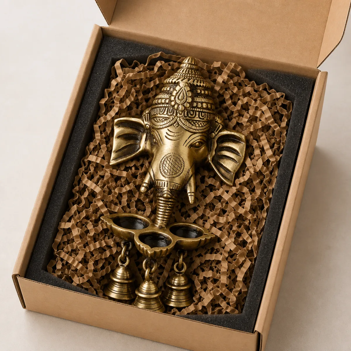 Brass Ganesha deepak wall hanging packed in a kraft gift box with foam for export