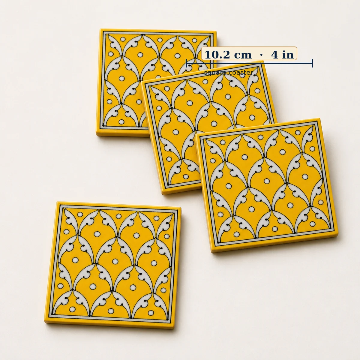 Jaipur Blue Pottery yellow jaal coasters showing approximately 4 inch / 10.2 cm square size