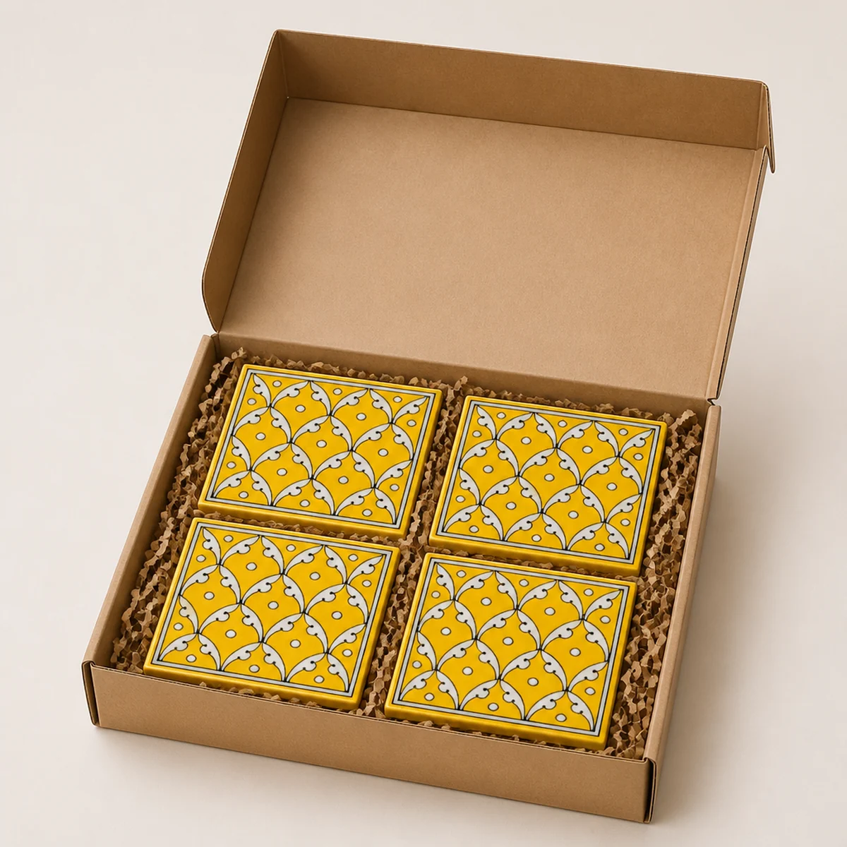 Jaipur Blue Pottery yellow jaal coaster set packed in a kraft gift box for export
